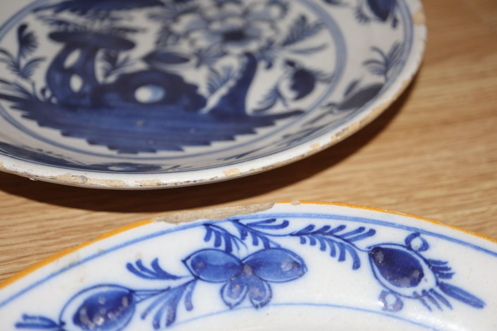 A collection of five 18th century Delft dishes, largest diameter 23cm